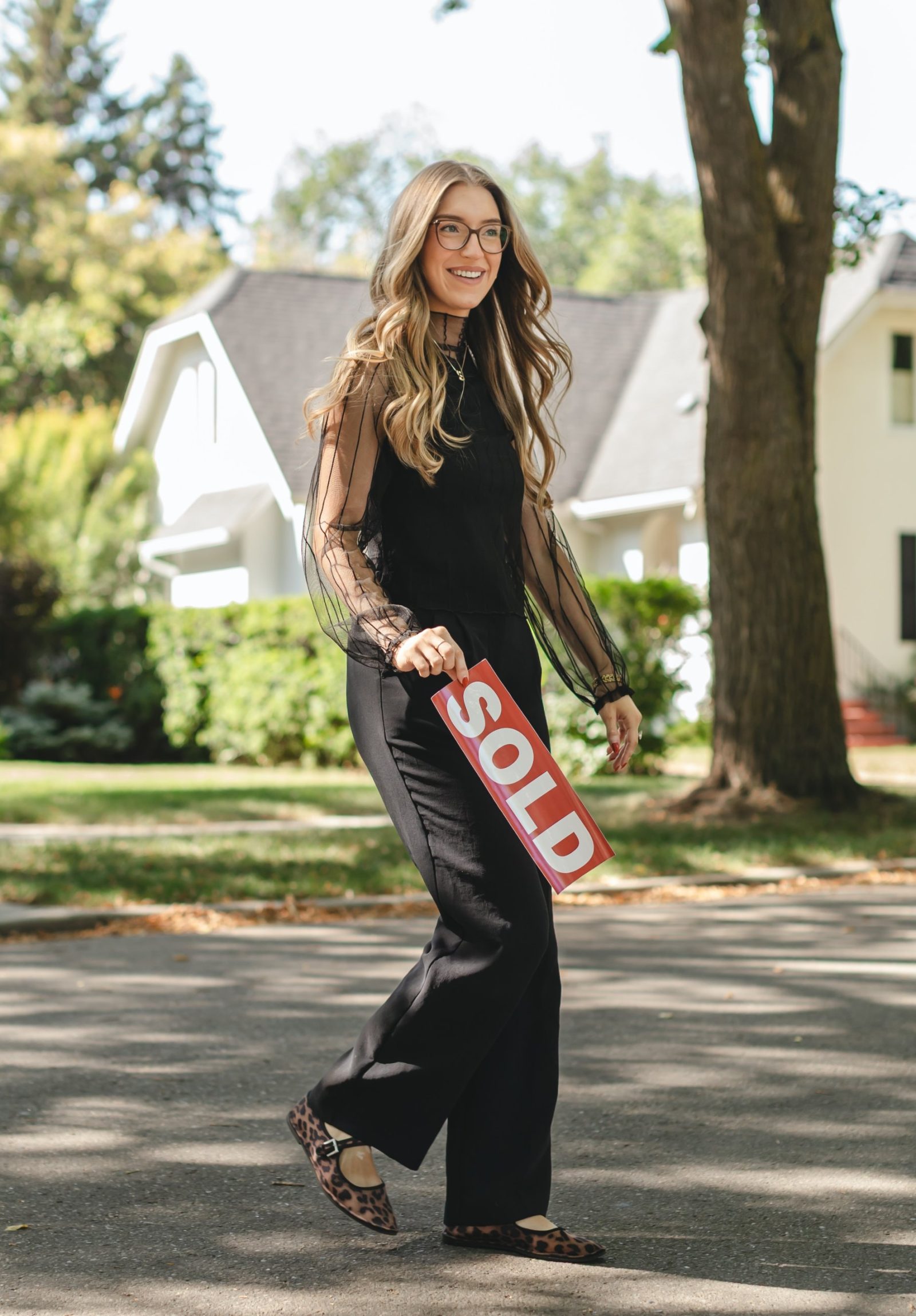 Brooklyn with a SOLD sign