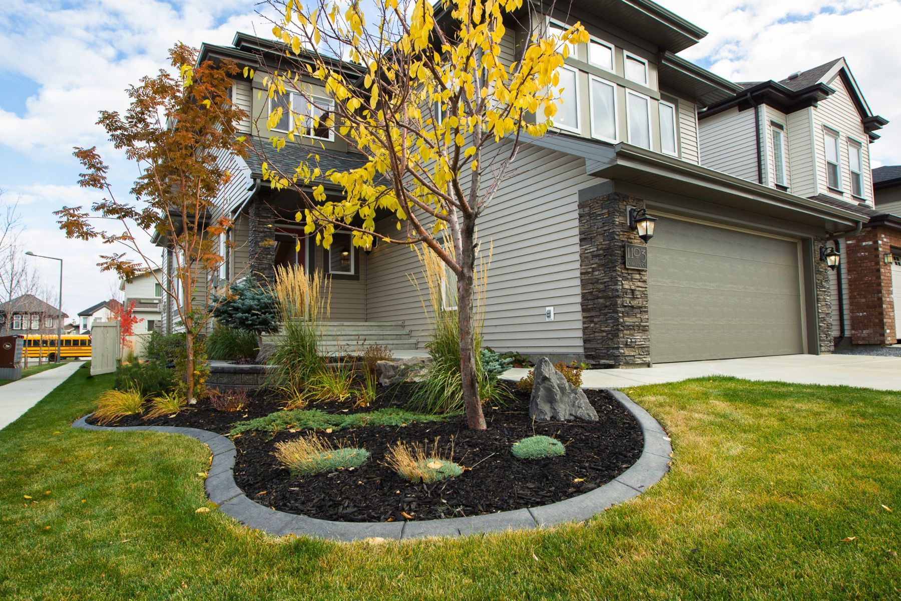 A landscaped front yard in the fall